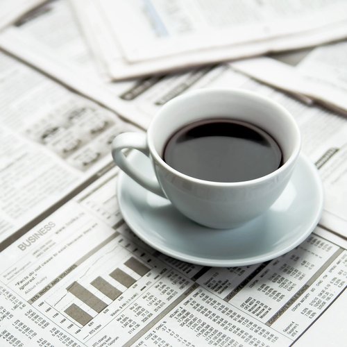Coffee on newspaper - Clifton's Carpet Shop in MO